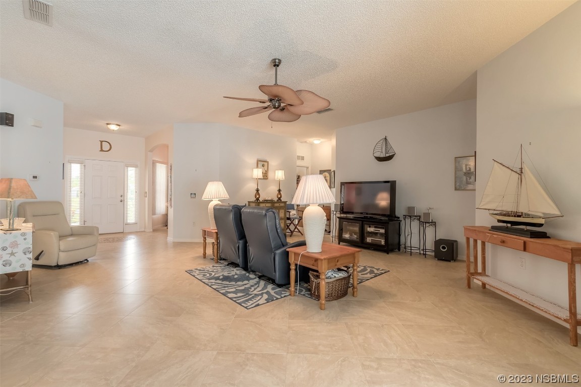 313 Mariners Gate Drive Edgewater, FL 32141 - Photo 24 of 55 a living room with furniture and a fireplace