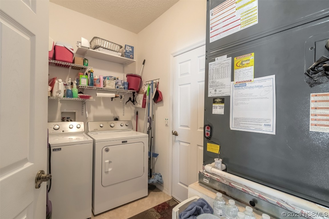 313 Mariners Gate Drive Edgewater, FL 32141 - Photo 37 of 55 a storage room with washer and dryer