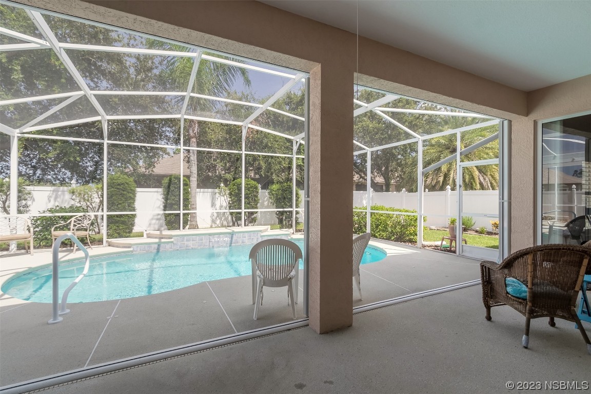 313 Mariners Gate Drive Edgewater, FL 32141 - Photo 38 of 55 a living room filled with furniture and a large window