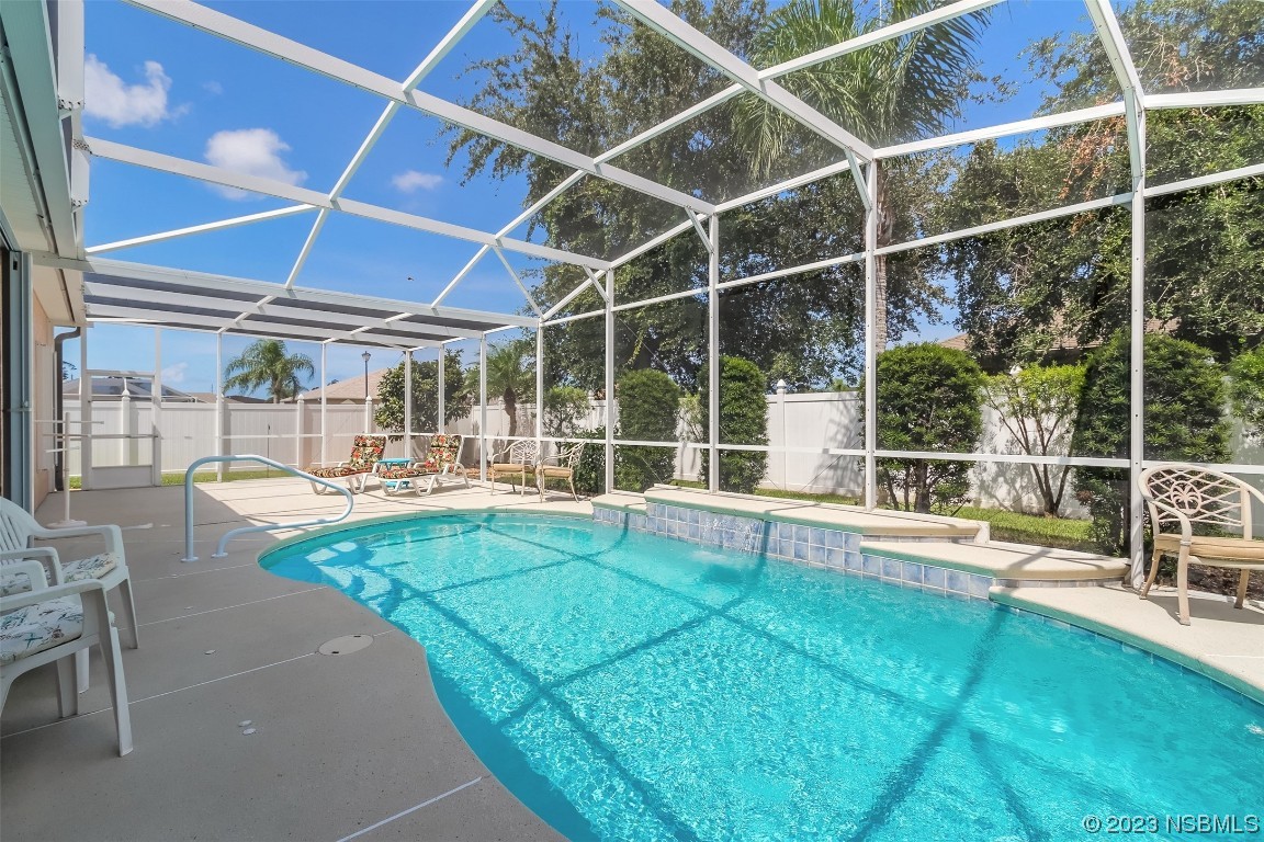 313 Mariners Gate Drive Edgewater, FL 32141 - Photo 40 of 55 a view of a backyard with swimming pool and sitting area