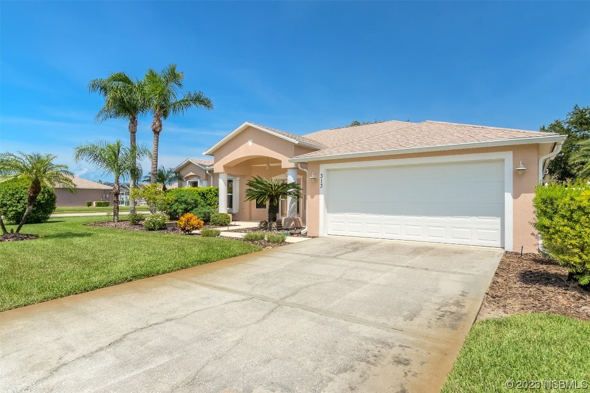313 Mariners Gate Drive Edgewater, FL 32141 - Photo 4 of 55 a front view of house with yard and green space