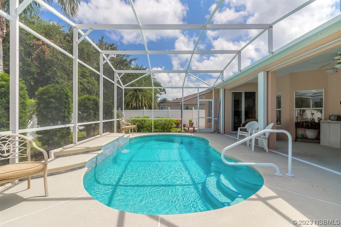 313 Mariners Gate Drive Edgewater, FL 32141 - Photo 42 of 55 a view of a swimming pool with a patio