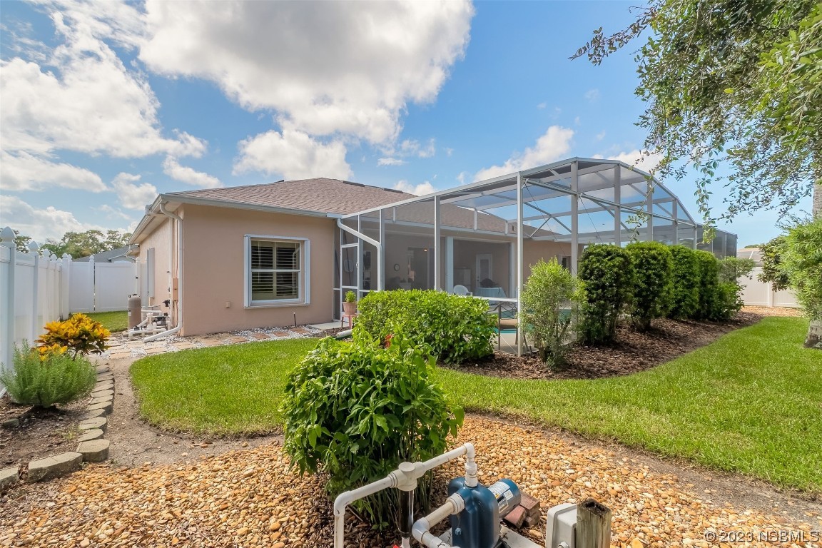 313 Mariners Gate Drive Edgewater, FL 32141 - Photo 45 of 55 a view of a house with backyard and garden