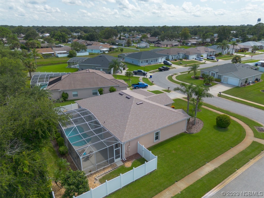 313 Mariners Gate Drive Edgewater, FL 32141 - Photo 49 of 55 an aerial view of a house with a garden and lake view
