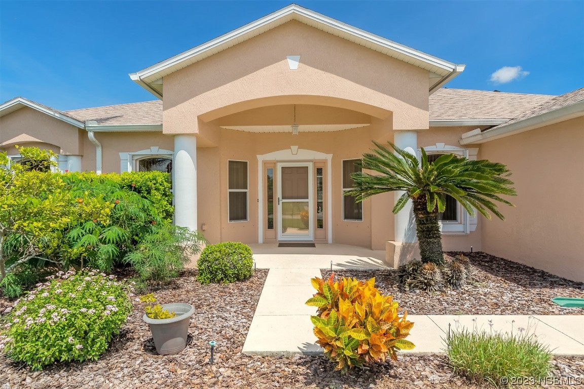 313 Mariners Gate Drive Edgewater, FL 32141 - Photo 5 of 55 a front view of a house with a yard