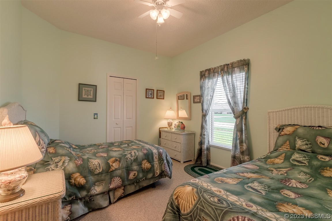 313 Mariners Gate Drive Edgewater, FL 32141 - Photo 10 of 55 a bedroom with a bed and window