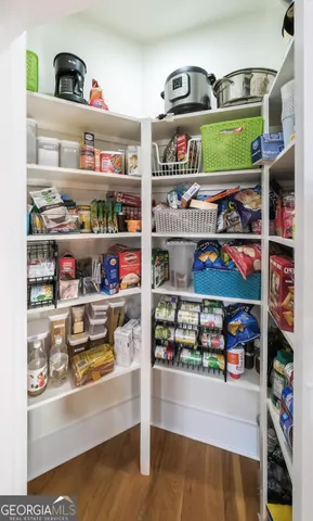 a spacious bathroom with a granite countertop sink a toilet and shower