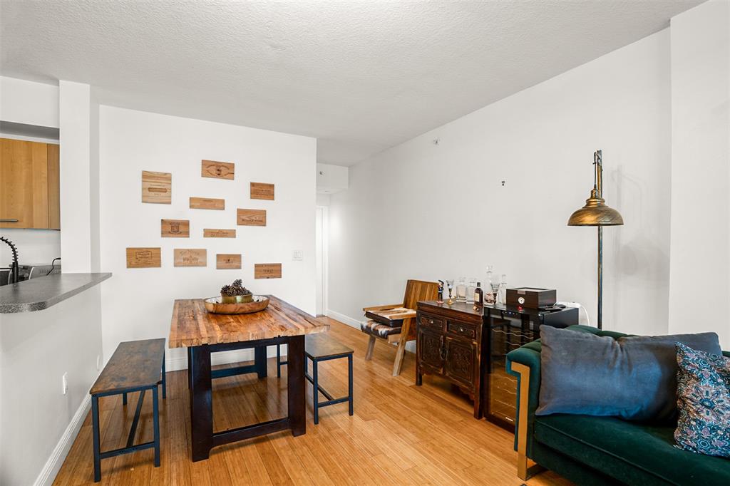 471 Northeast 25th Street, Unit 503 Miami, FL 33137 - Photo 11 of 29 a living room with furniture and wooden floor