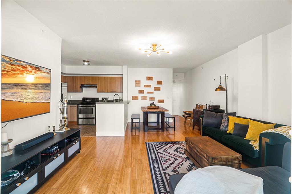 471 Northeast 25th Street, Unit 503 Miami, FL 33137 - Photo 12 of 29 a living room with furniture and a flat screen tv