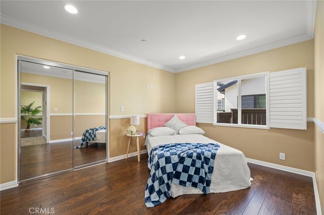 a spacious bedroom with a large bed and a window