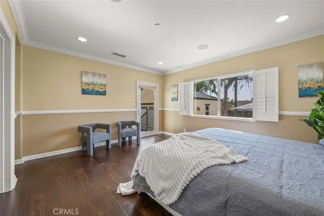 a spacious bedroom with a large bed and a window