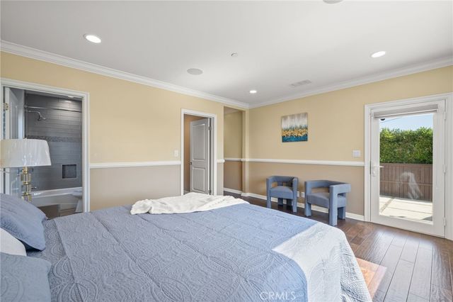 a view of a patio with a table and chairs under an umbrella