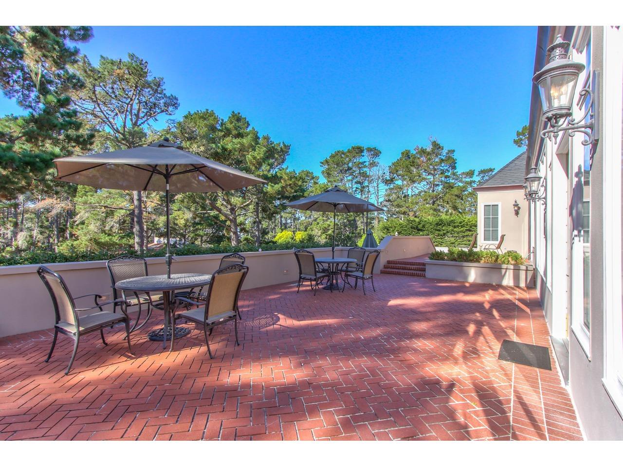 3140 Spruance Road Pebble Beach, CA 93953 - Photo 12 of 70 a patio with tables and chairs