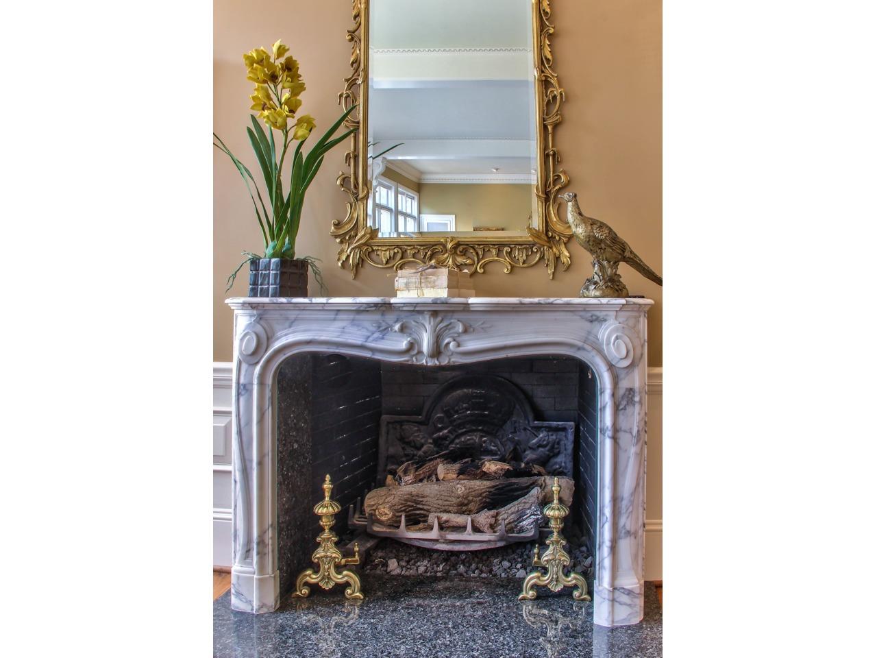 3140 Spruance Road Pebble Beach, CA 93953 - Photo 14 of 70 a living room with a fireplace and a potted plant