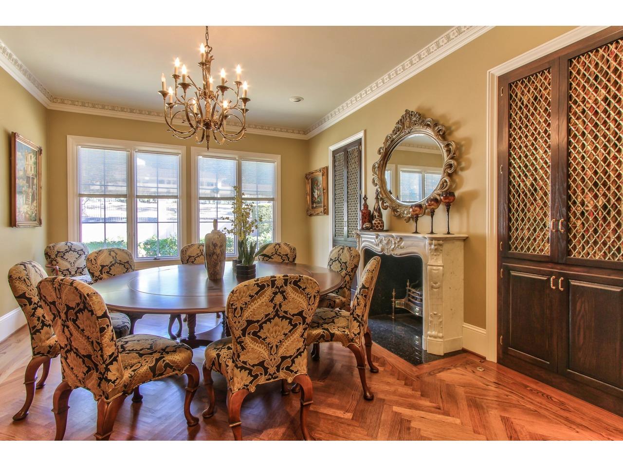 3140 Spruance Road Pebble Beach, CA 93953 - Photo 17 of 70 a view of a dining room with furniture a chandelier and wooden floor