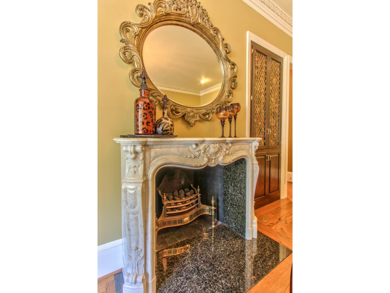 3140 Spruance Road Pebble Beach, CA 93953 - Photo 18 of 70 a living room with a fireplace and a table