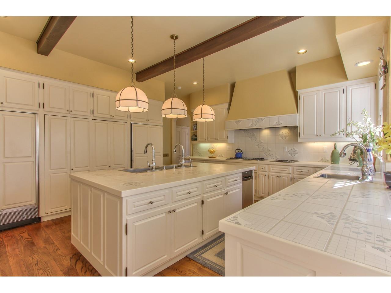 3140 Spruance Road Pebble Beach, CA 93953 - Photo 19 of 70 a kitchen with a sink a counter space and appliances