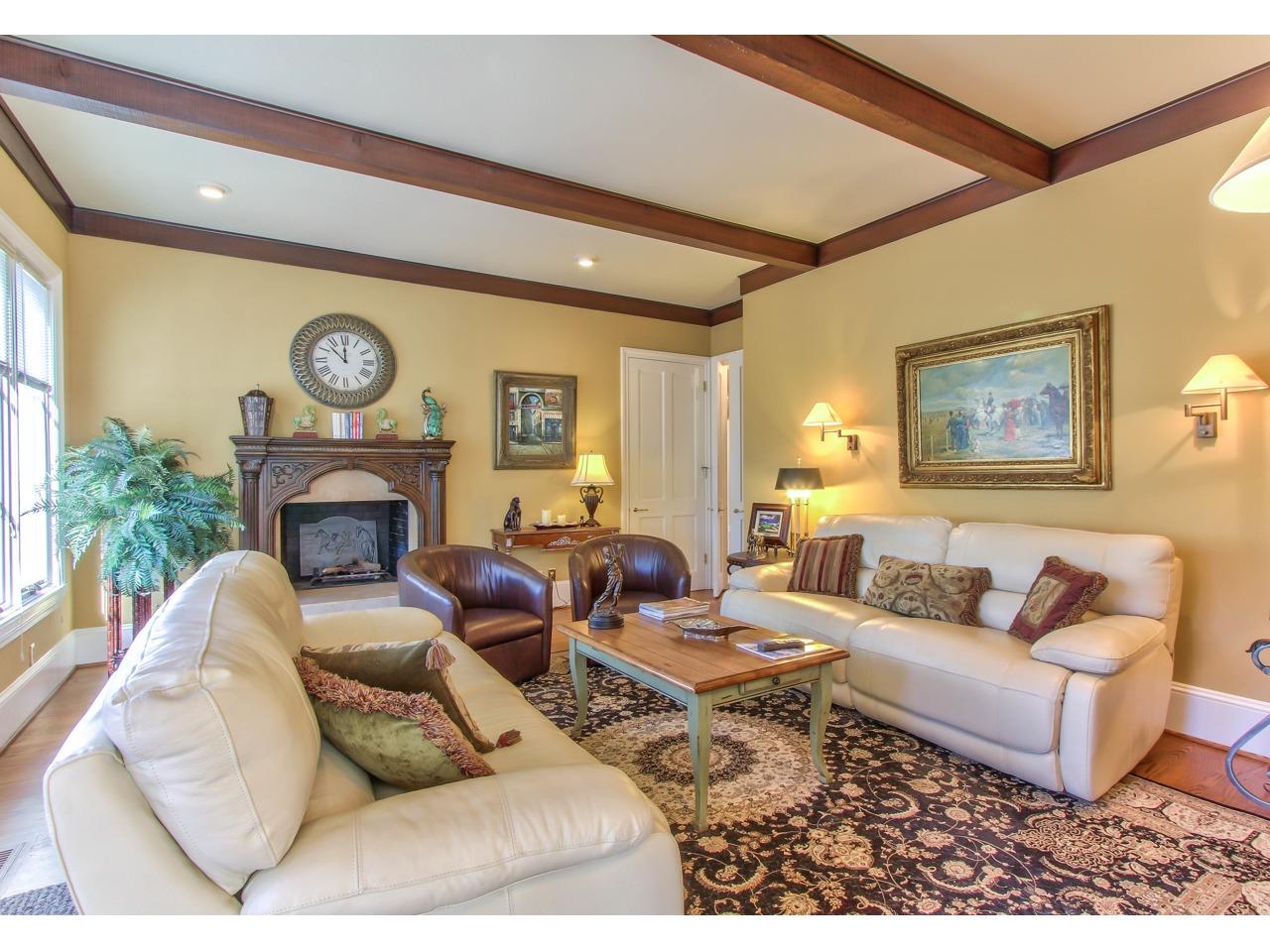 3140 Spruance Road Pebble Beach, CA 93953 - Photo 24 of 70 a living room with furniture a clock and a fireplace