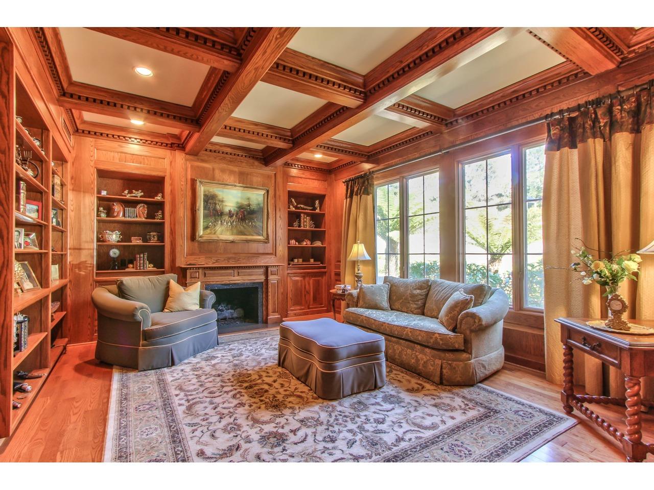 3140 Spruance Road Pebble Beach, CA 93953 - Photo 27 of 70 a living room with furniture a fireplace and a large window