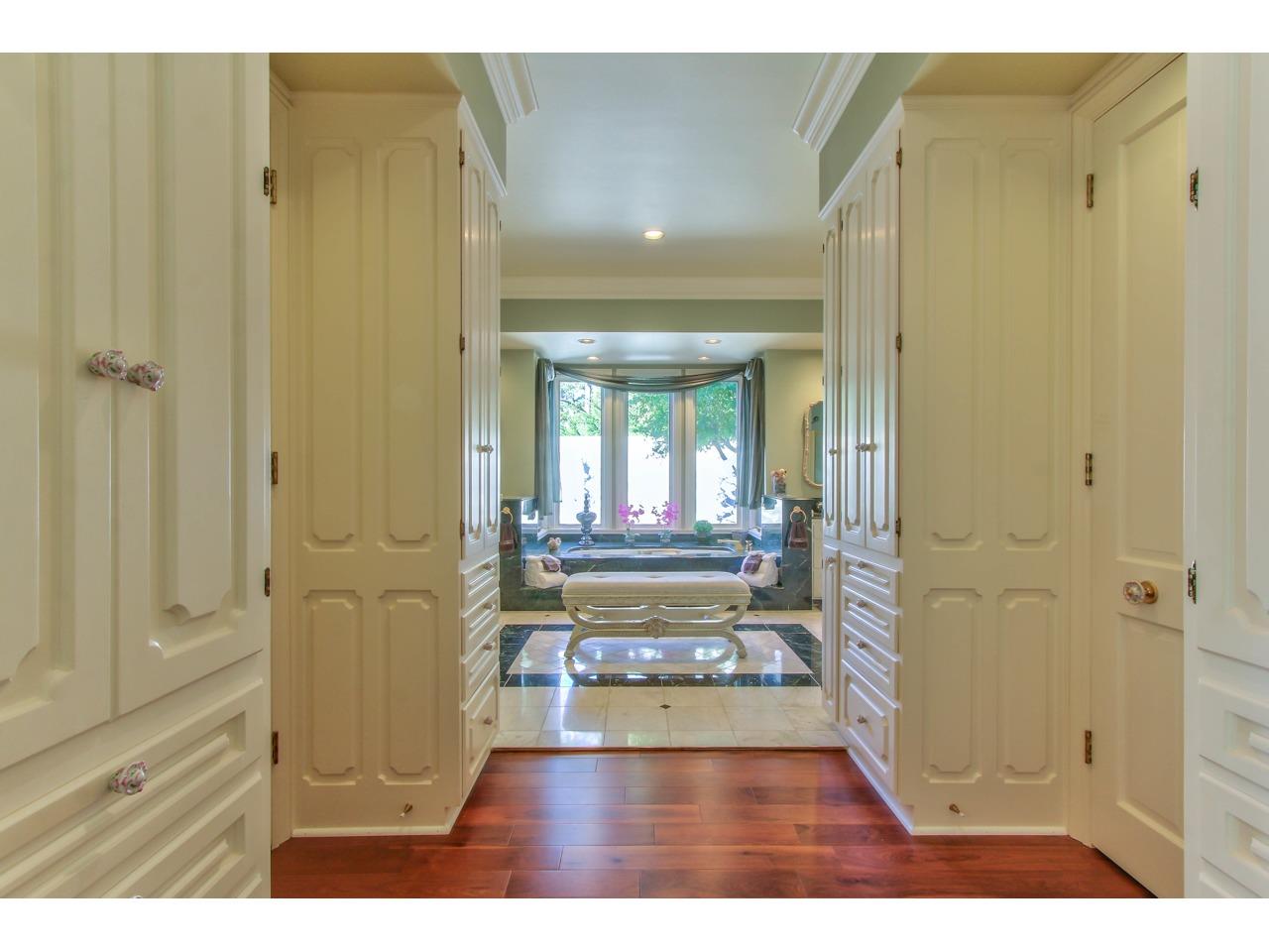 3140 Spruance Road Pebble Beach, CA 93953 - Photo 33 of 70 a view of a hallway with wooden floor and a bathroom