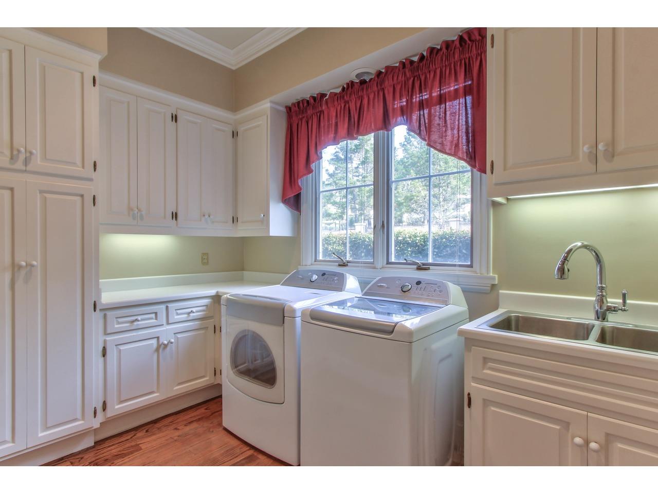 3140 Spruance Road Pebble Beach, CA 93953 - Photo 42 of 70 a kitchen with a sink a stove and cabinets