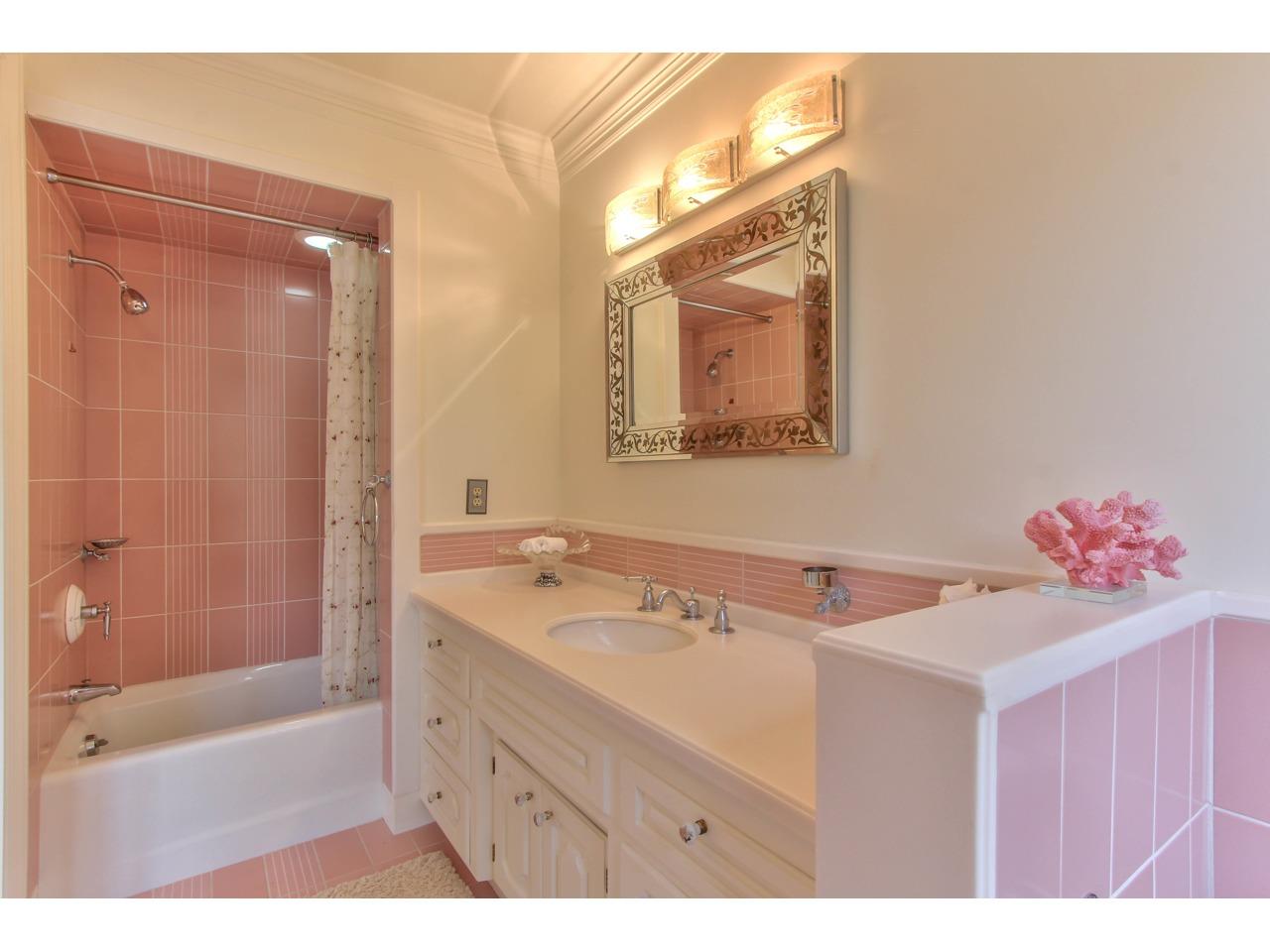 3140 Spruance Road Pebble Beach, CA 93953 - Photo 54 of 70 a bathroom with a sink mirror and a bath tub