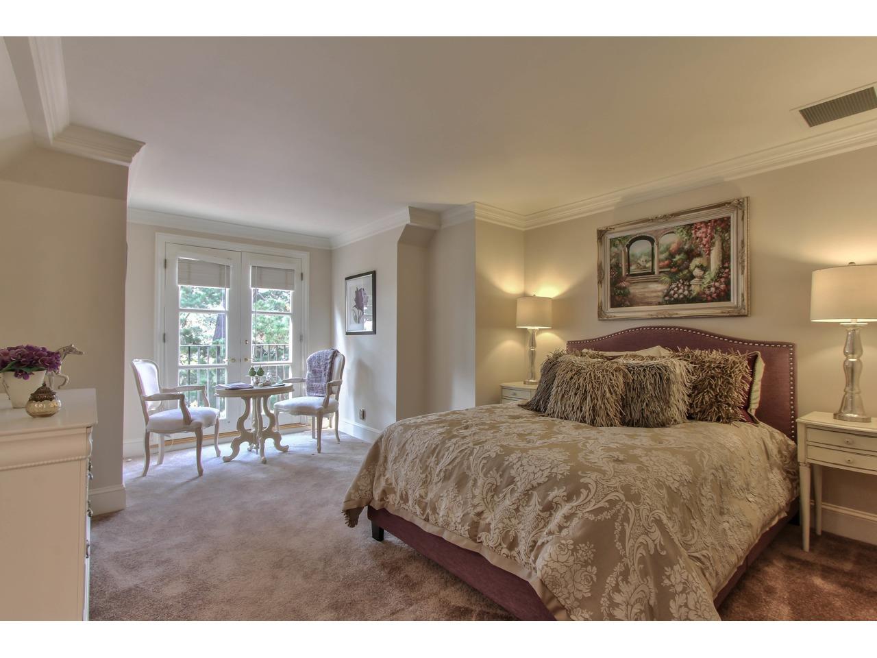 3140 Spruance Road Pebble Beach, CA 93953 - Photo 56 of 70 a bedroom with a large bed and furniture
