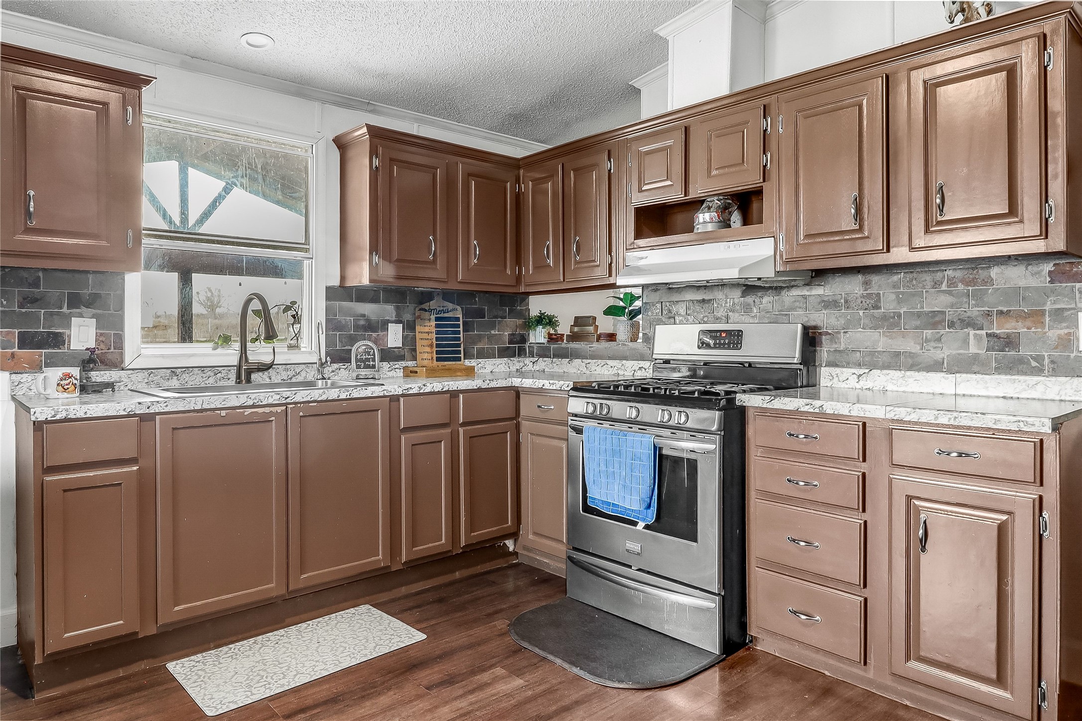 Tbd Giese Lane Elgin, TX 78621 - Photo 11 of 34 a kitchen with stainless steel appliances granite countertop a sink stove and cabinets