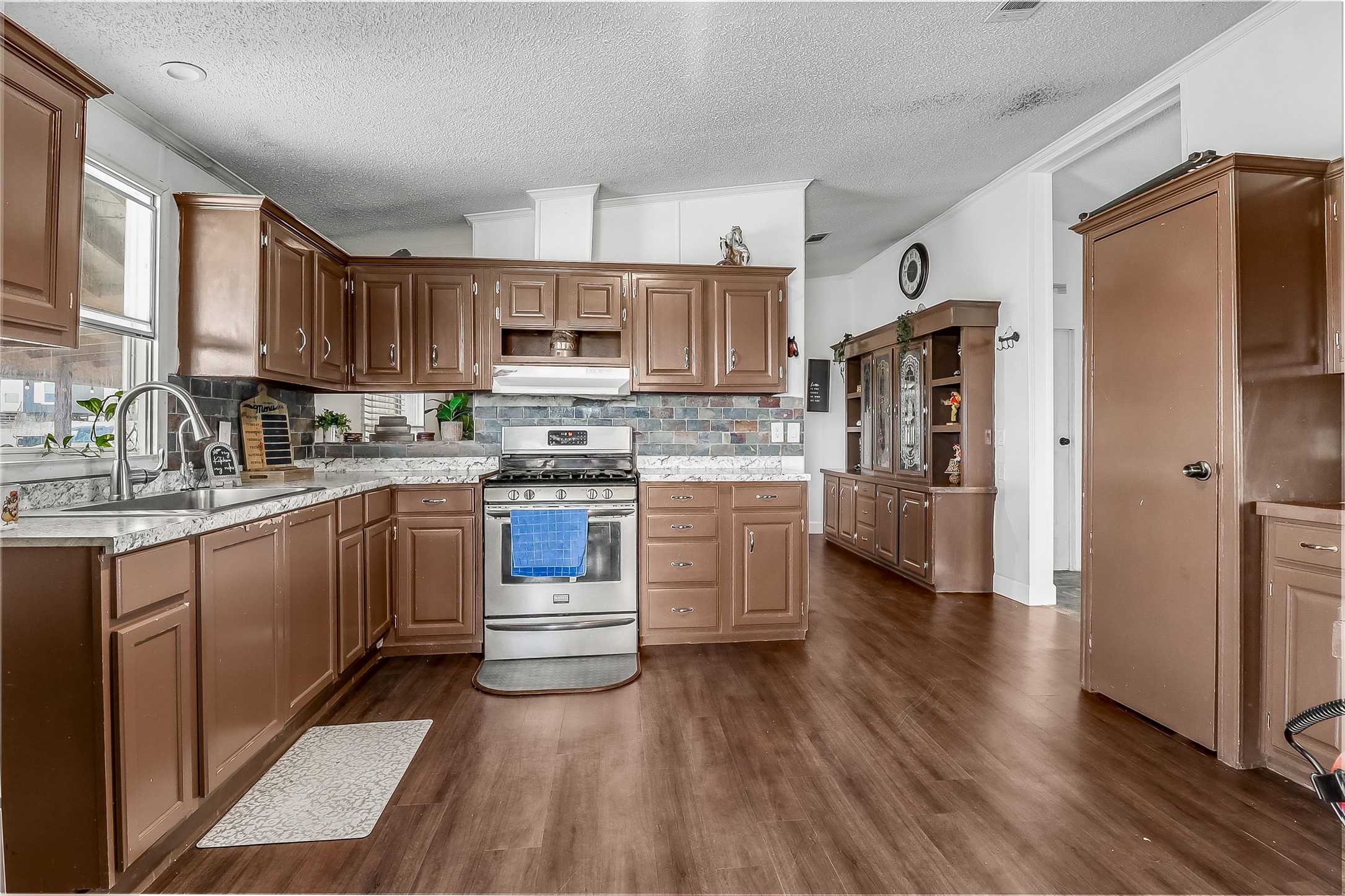 Tbd Giese Lane Elgin, TX 78621 - Photo 12 of 34 a kitchen with stainless steel appliances a refrigerator sink and cabinets