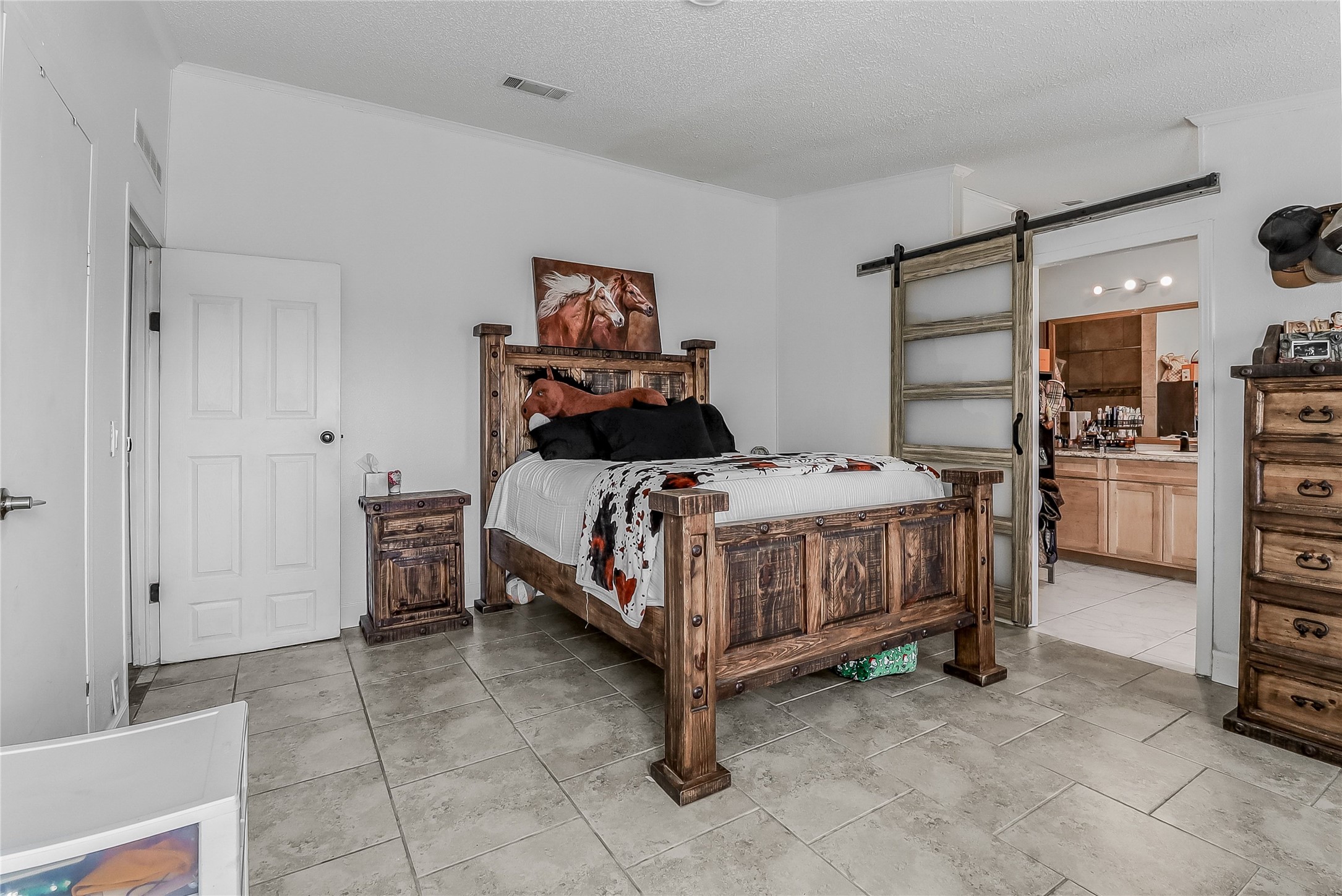 Tbd Giese Lane Elgin, TX 78621 - Photo 15 of 34 a bedroom with a bed and a cabinets