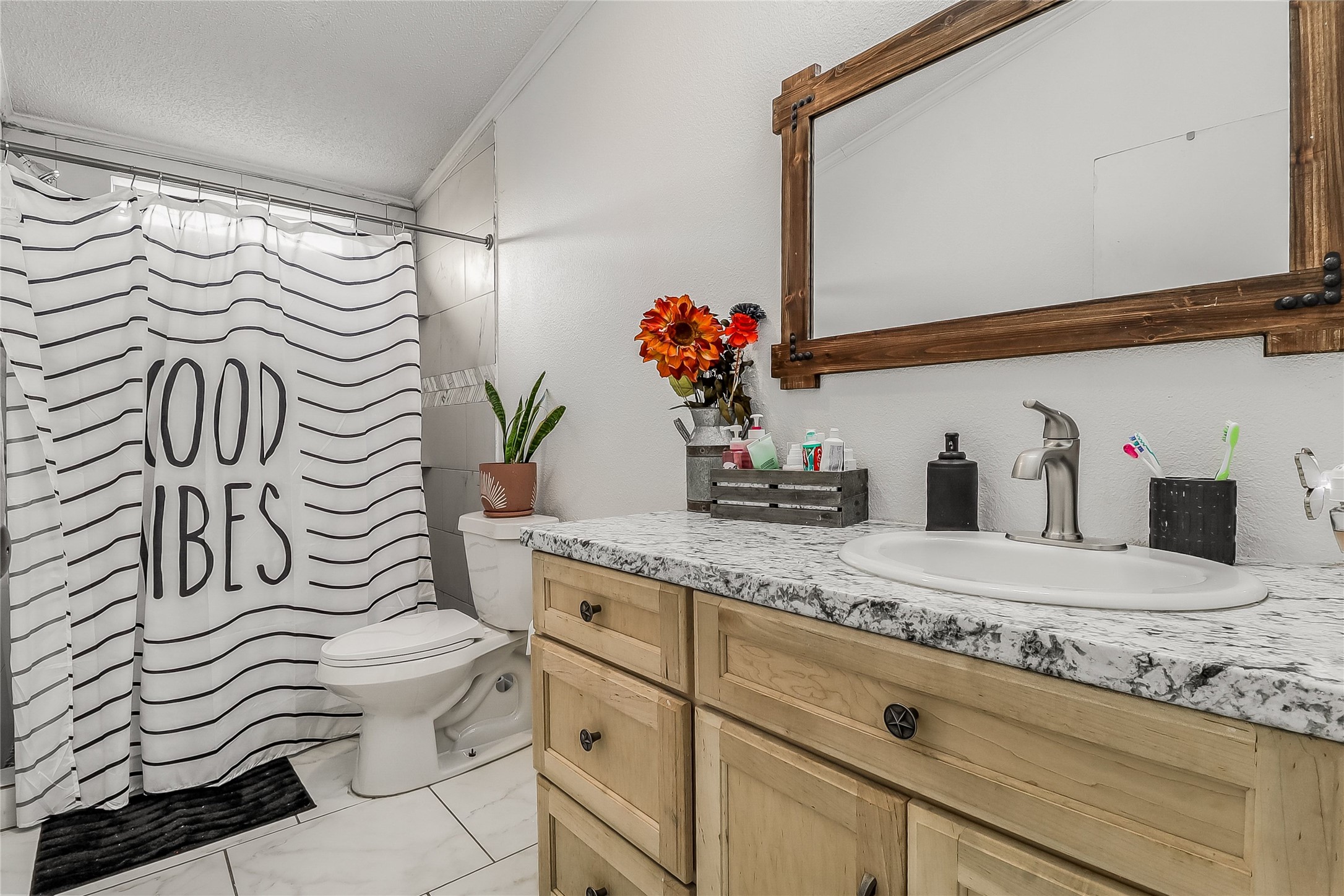 Tbd Giese Lane Elgin, TX 78621 - Photo 21 of 34 a bathroom with a sink a mirror and a shower