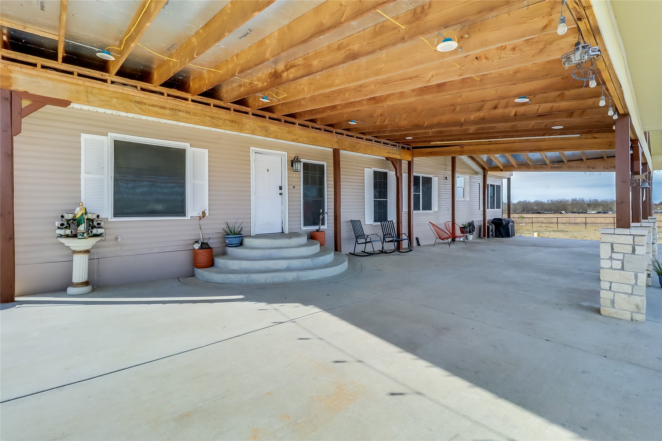 Tbd Giese Lane Elgin, TX 78621 - Photo 3 of 34 a view of a porch with seating space