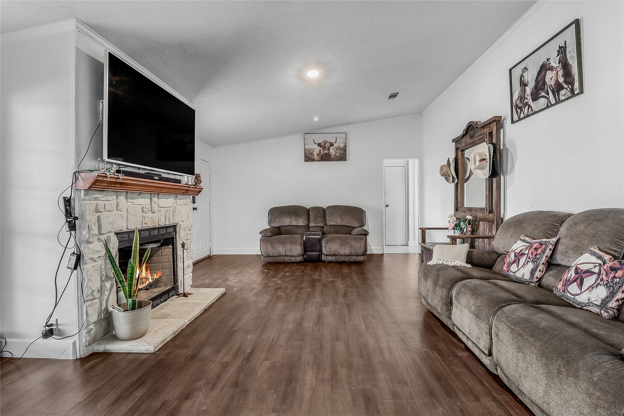 Tbd Giese Lane Elgin, TX 78621 - Photo 7 of 34 a living room with furniture a fireplace and a flat screen tv