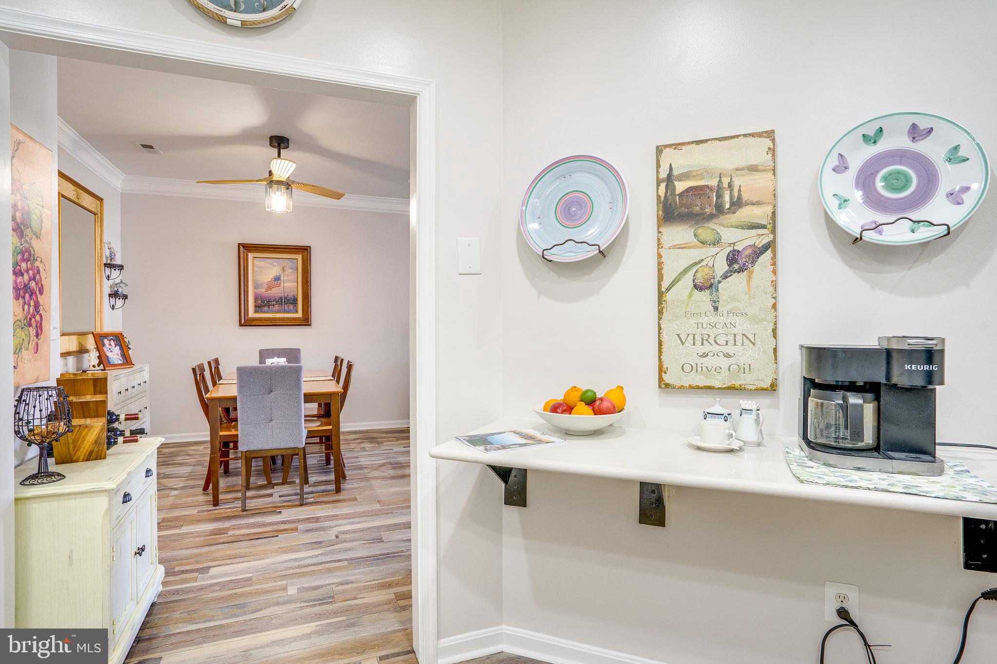 6902 Walnut Hill Drive Gainesville, VA 20155 - Photo 16 of 41 a view of a dining room with furniture and wooden floor
