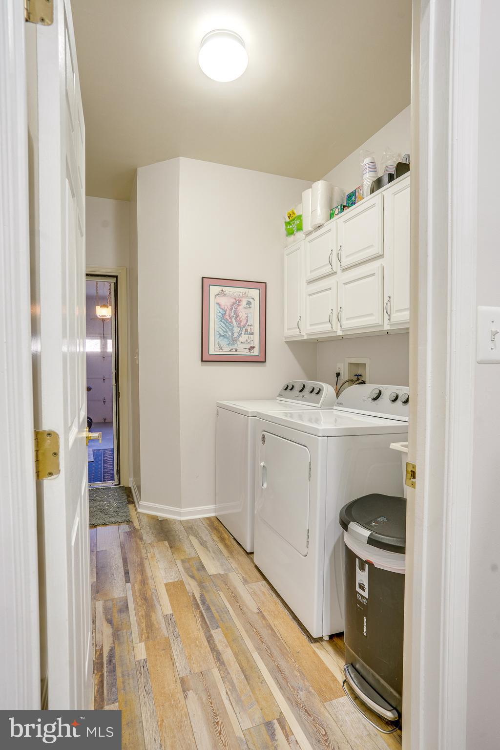 6902 Walnut Hill Drive Gainesville, VA 20155 - Photo 17 of 41 a kitchen with a sink stove and white cabinets