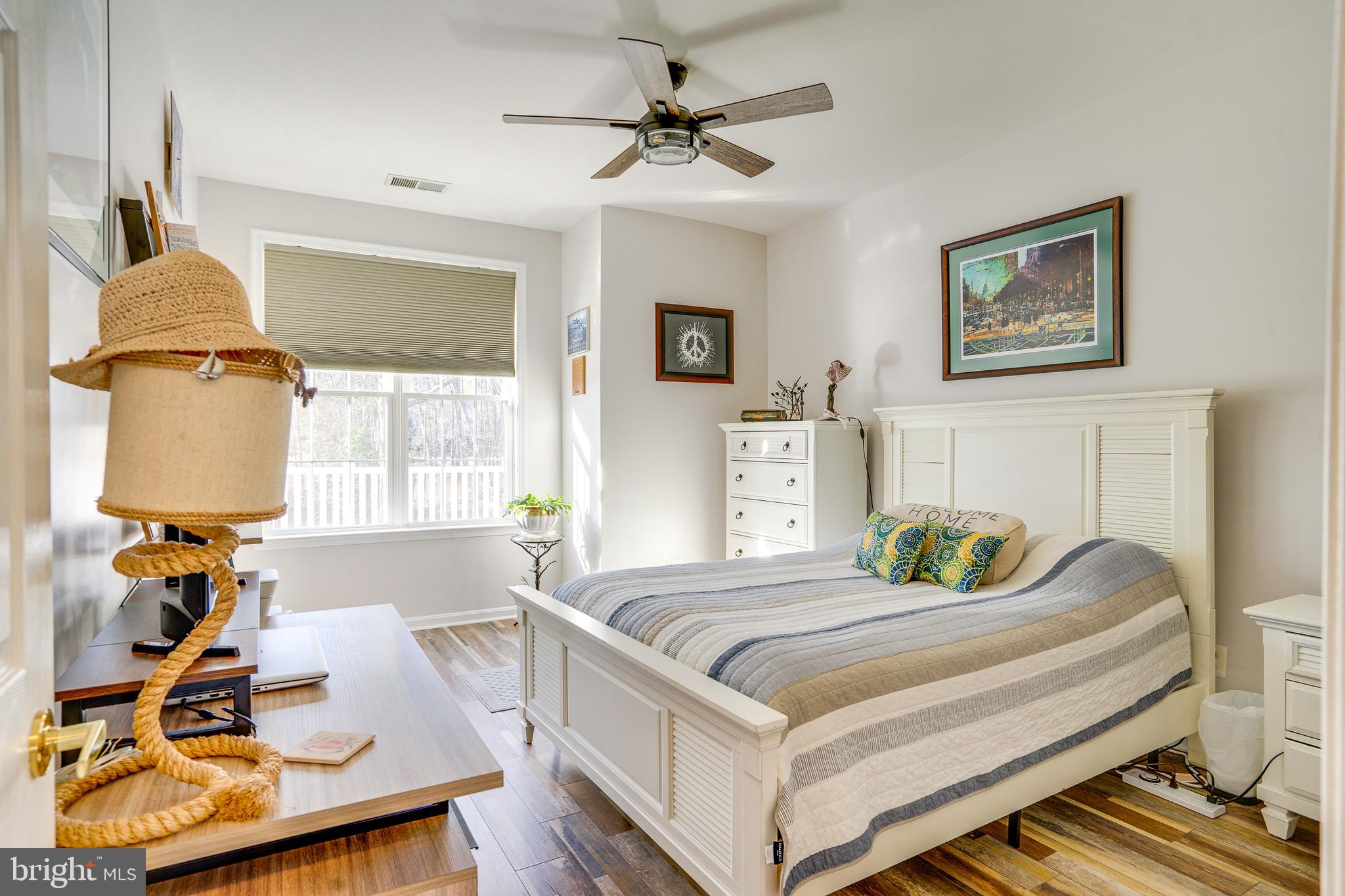 6902 Walnut Hill Drive Gainesville, VA 20155 - Photo 20 of 41 a bedroom with a bed and a table