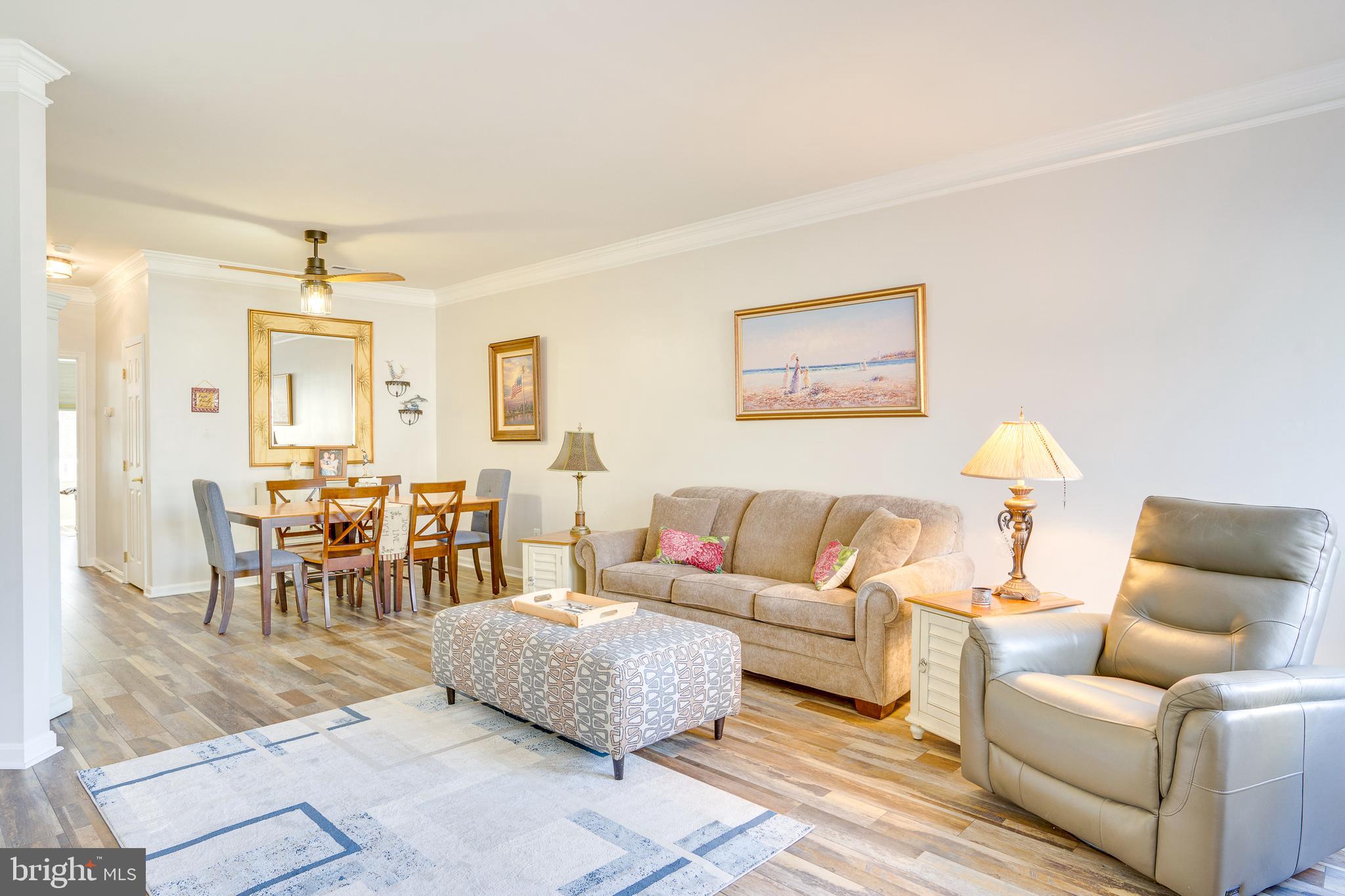 6902 Walnut Hill Drive Gainesville, VA 20155 - Photo 2 of 41 a living room with furniture and a chandelier
