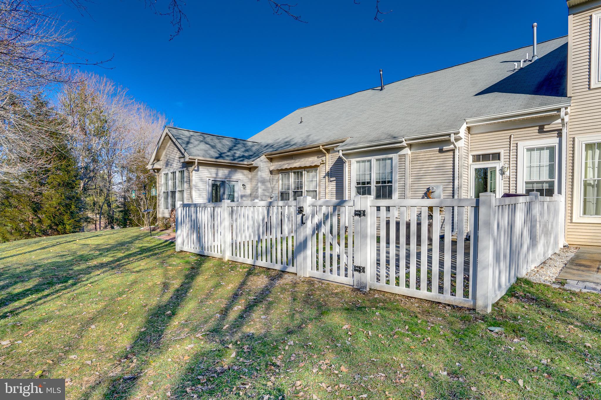 6902 Walnut Hill Drive Gainesville, VA 20155 - Photo 29 of 41 a view of a house with a big yard and large trees