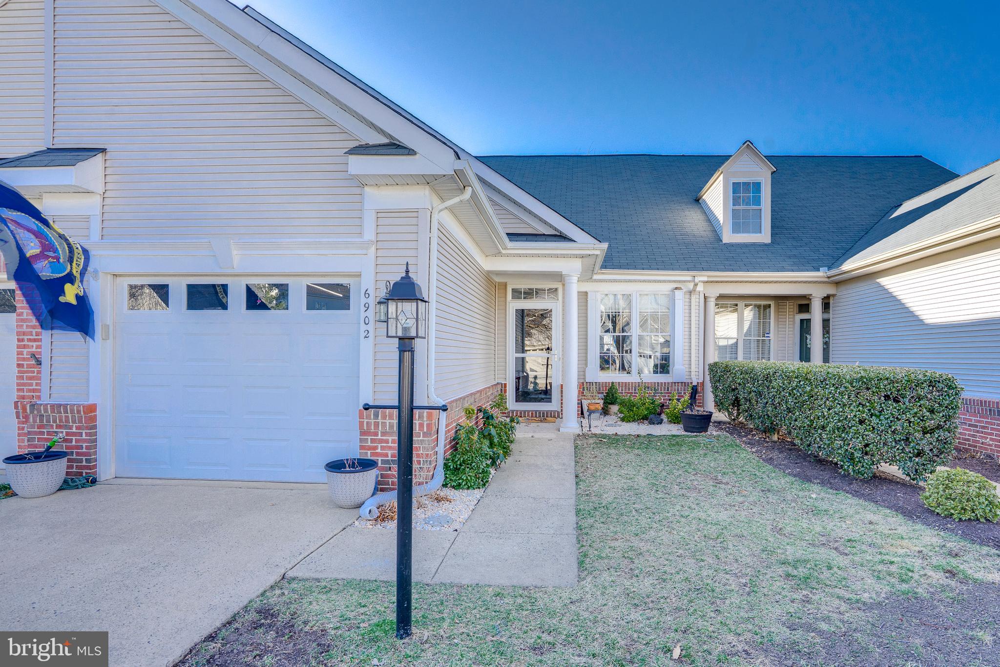 6902 Walnut Hill Drive Gainesville, VA 20155 - Photo 37 of 41 a view of a house with a yard and plants