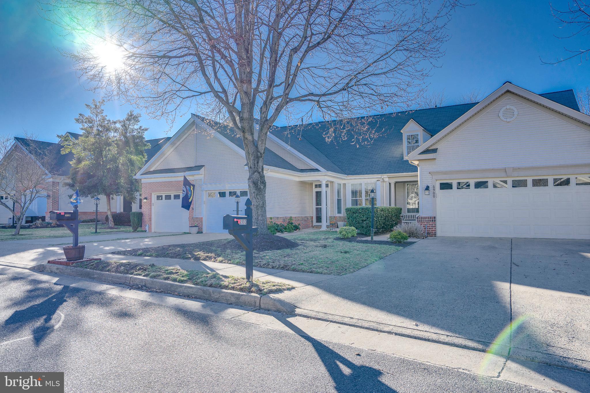 6902 Walnut Hill Drive Gainesville, VA 20155 - Photo 40 of 41 a view of a house with a yard and large tree