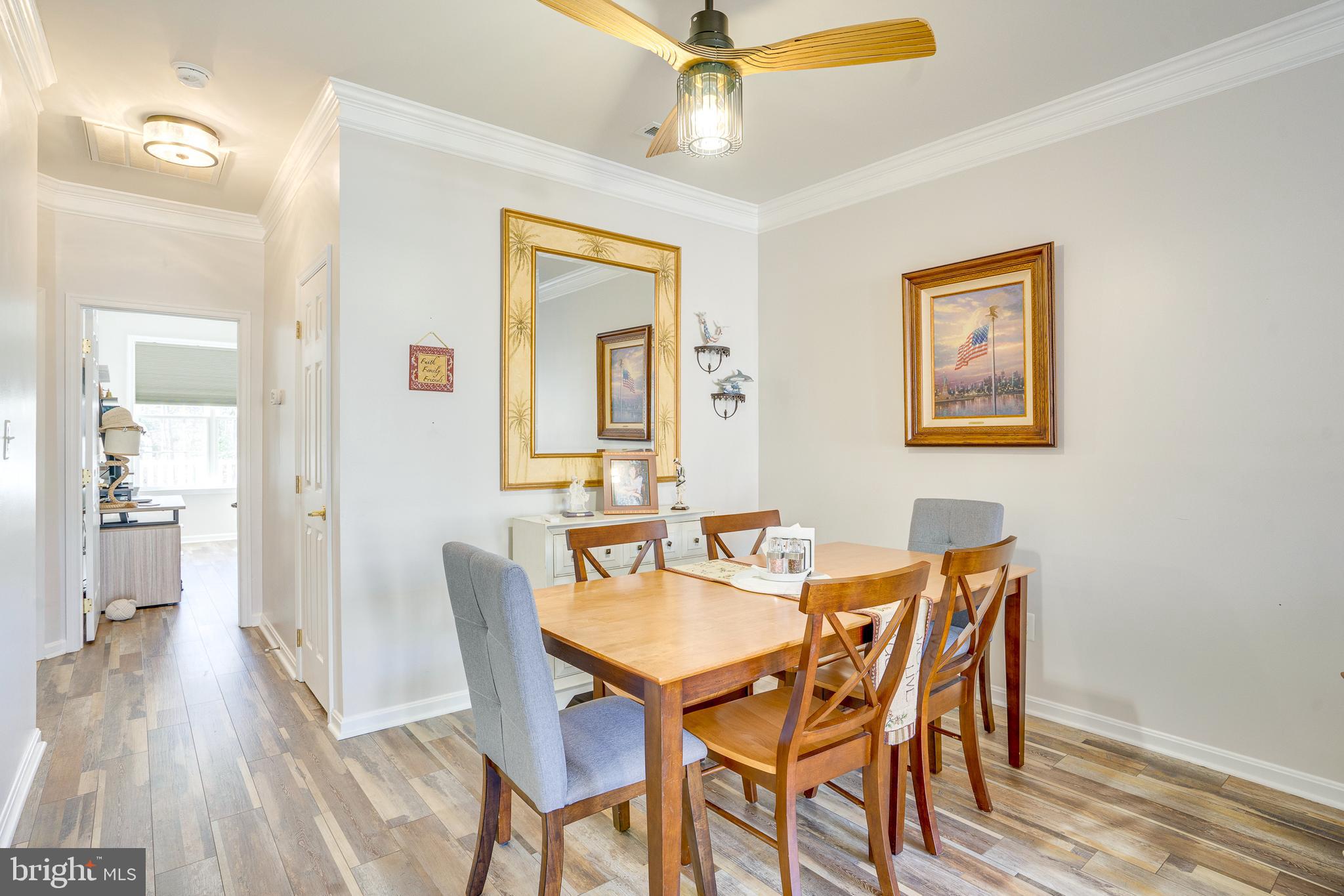 6902 Walnut Hill Drive Gainesville, VA 20155 - Photo 7 of 41 a view of a dining room with furniture and wooden floor