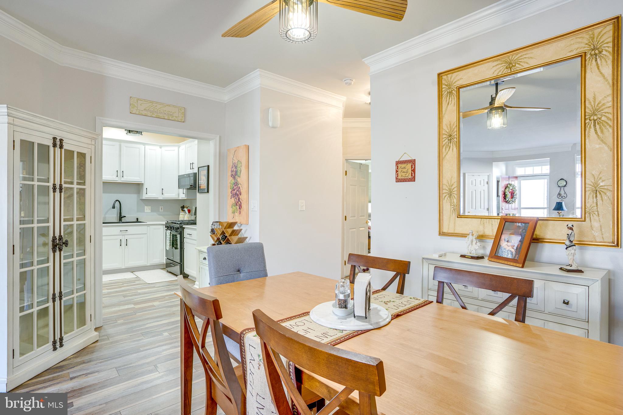 6902 Walnut Hill Drive Gainesville, VA 20155 - Photo 8 of 41 a view of a dining room with furniture and wooden floor
