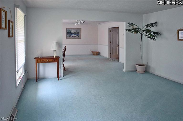 Bright open living and dining rooms open off the foyer.