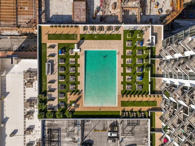 a view of a wooden door and brick wall