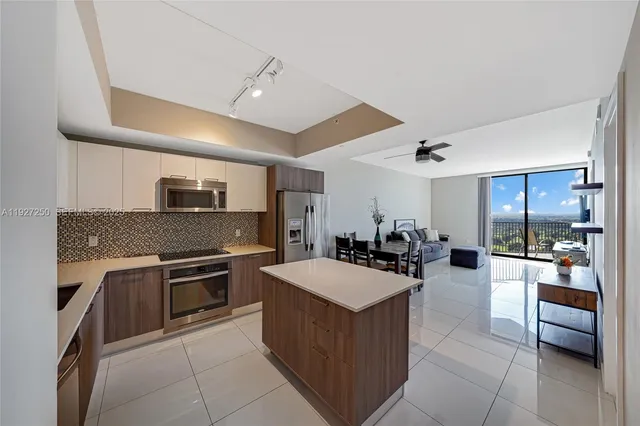 a kitchen with a sink stove and refrigerator