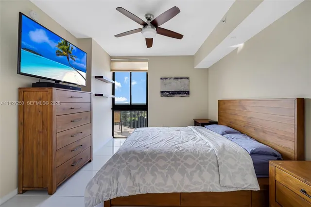 a bedroom with a bed and a cabinet