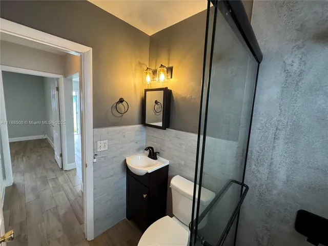 a view of a bathroom from the hallway