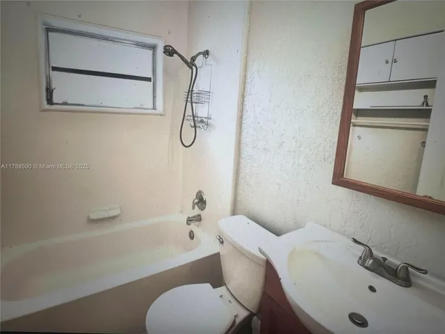 a bathroom with a sink and a bathtub