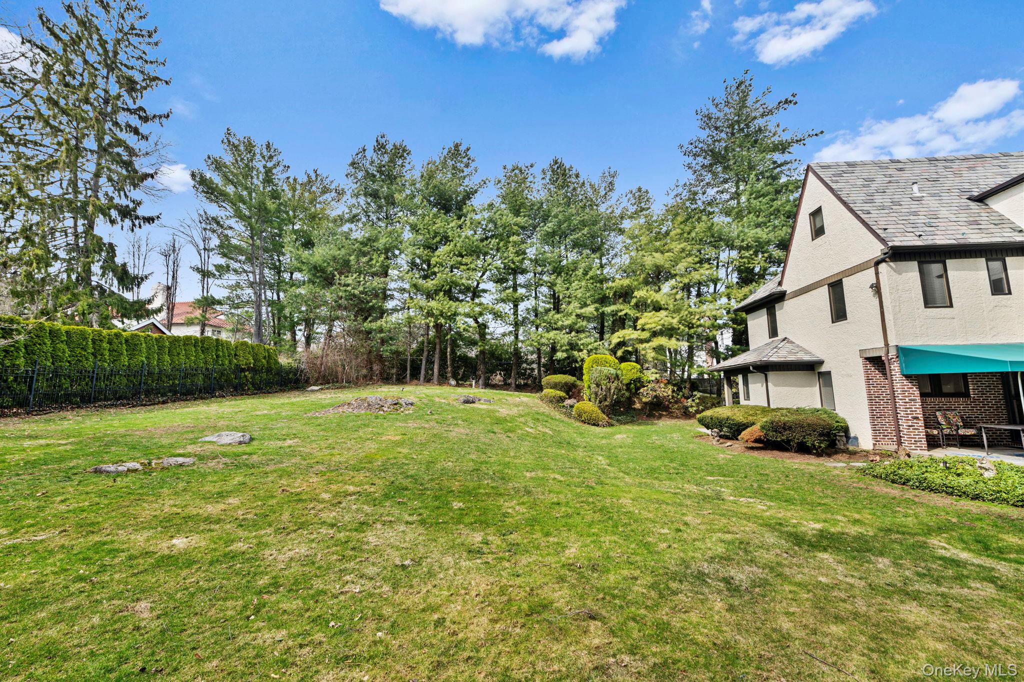 44 Fenimore Road New Rochelle, NY 10804 - Photo 39 of 46 a front view of a house with garden