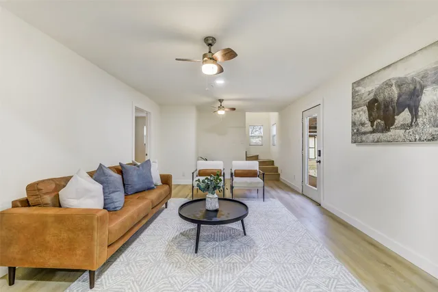 a living room with furniture and a rug